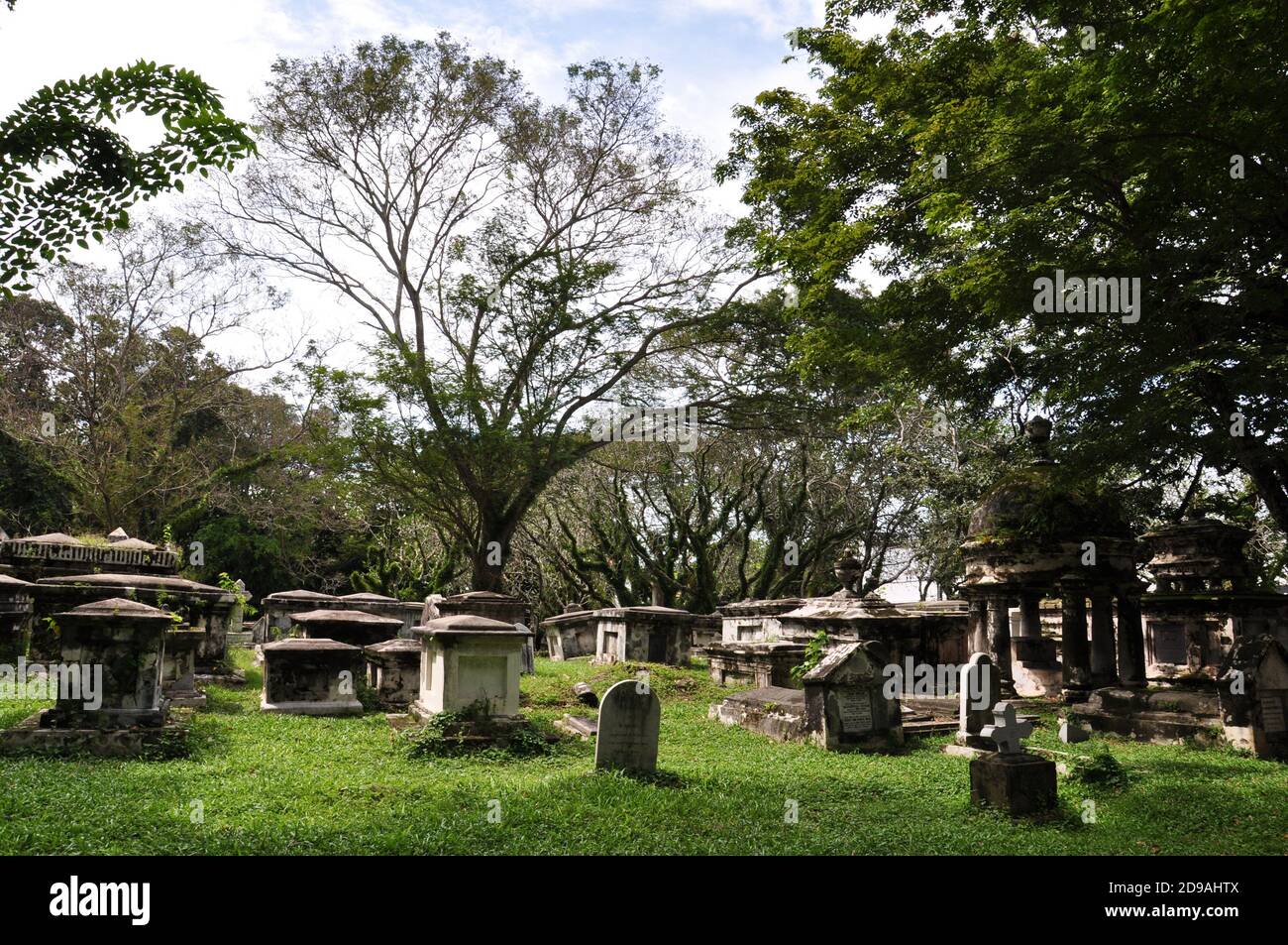 Old Anglican cemetery with large decaying tombstones and burial vaults. Stock Photo