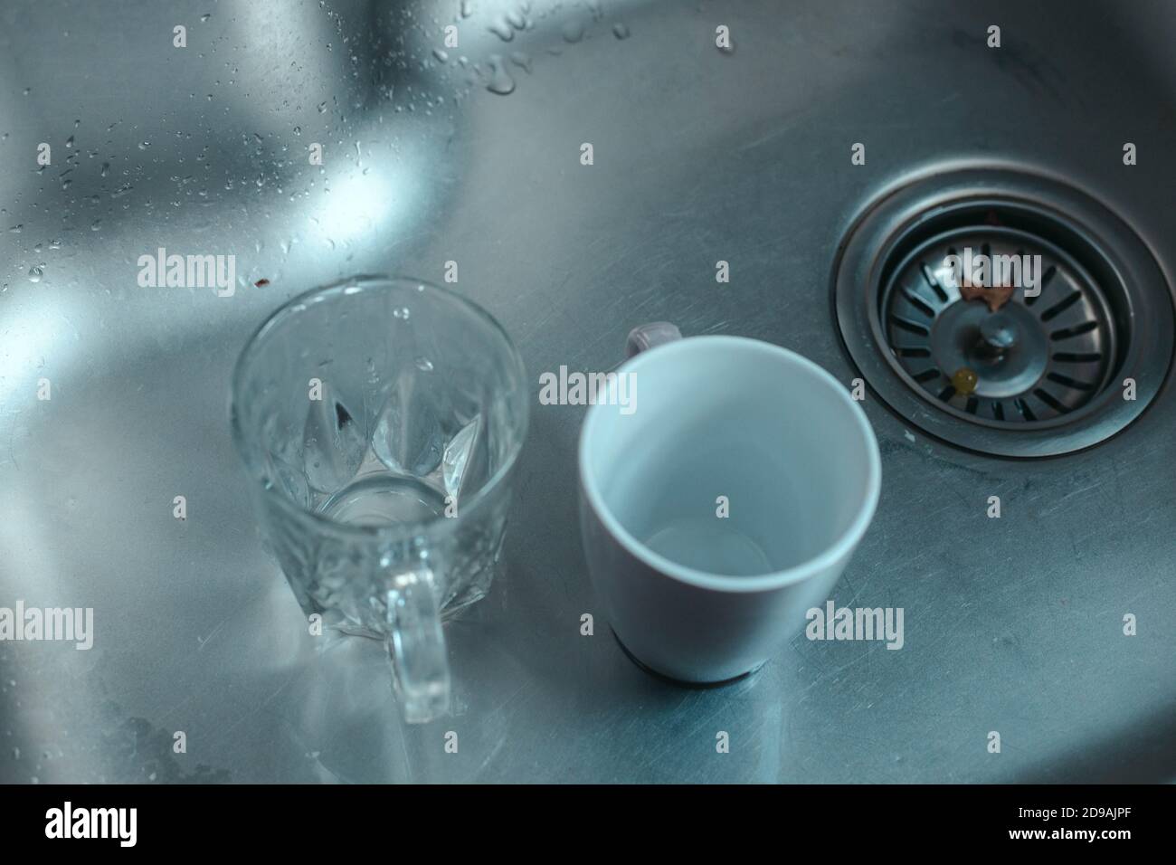 Dirty glass and ceramic cups in the sink,washing up Stock Photo Alamy