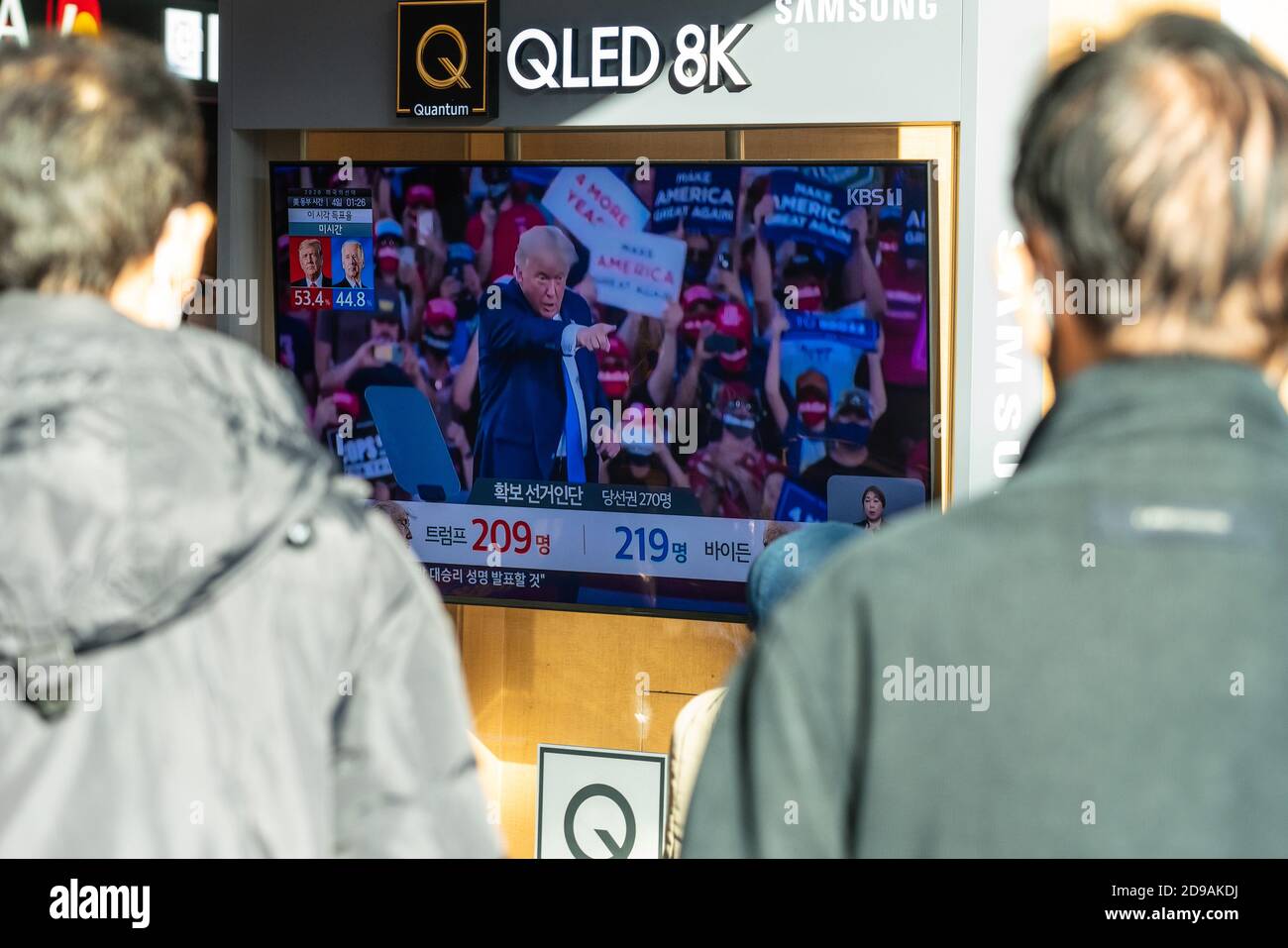 People at Seoul Train Station watch news report about the US Presidential election on 2020 US presidential election day. Stock Photo