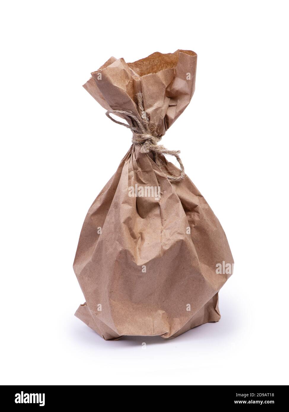 Paper bag with rope and folds isolated on white background Stock Photo ...
