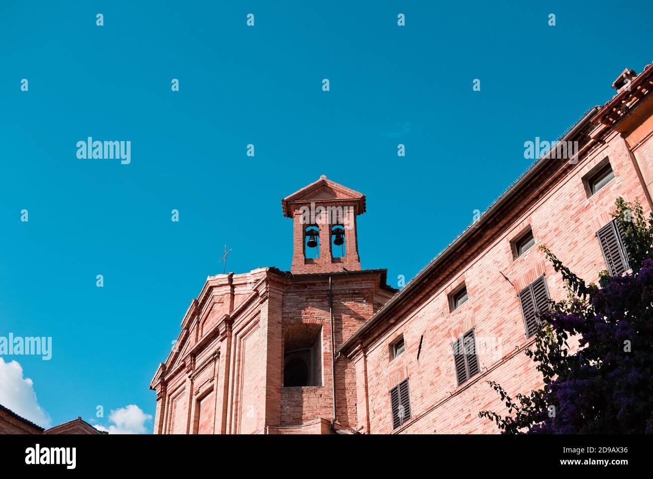 A bell tower of a medieval church with two bells in an italian village (Corinaldo, Marche, Italy) Stock Photo