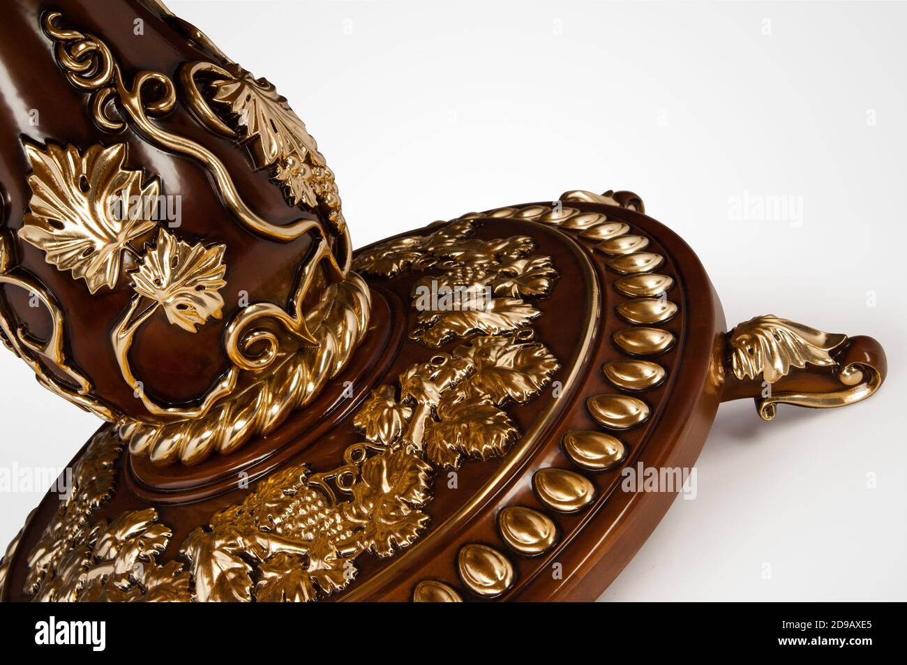 Luxury gold plated leg kitchen table in baroque style. Closeup Stock