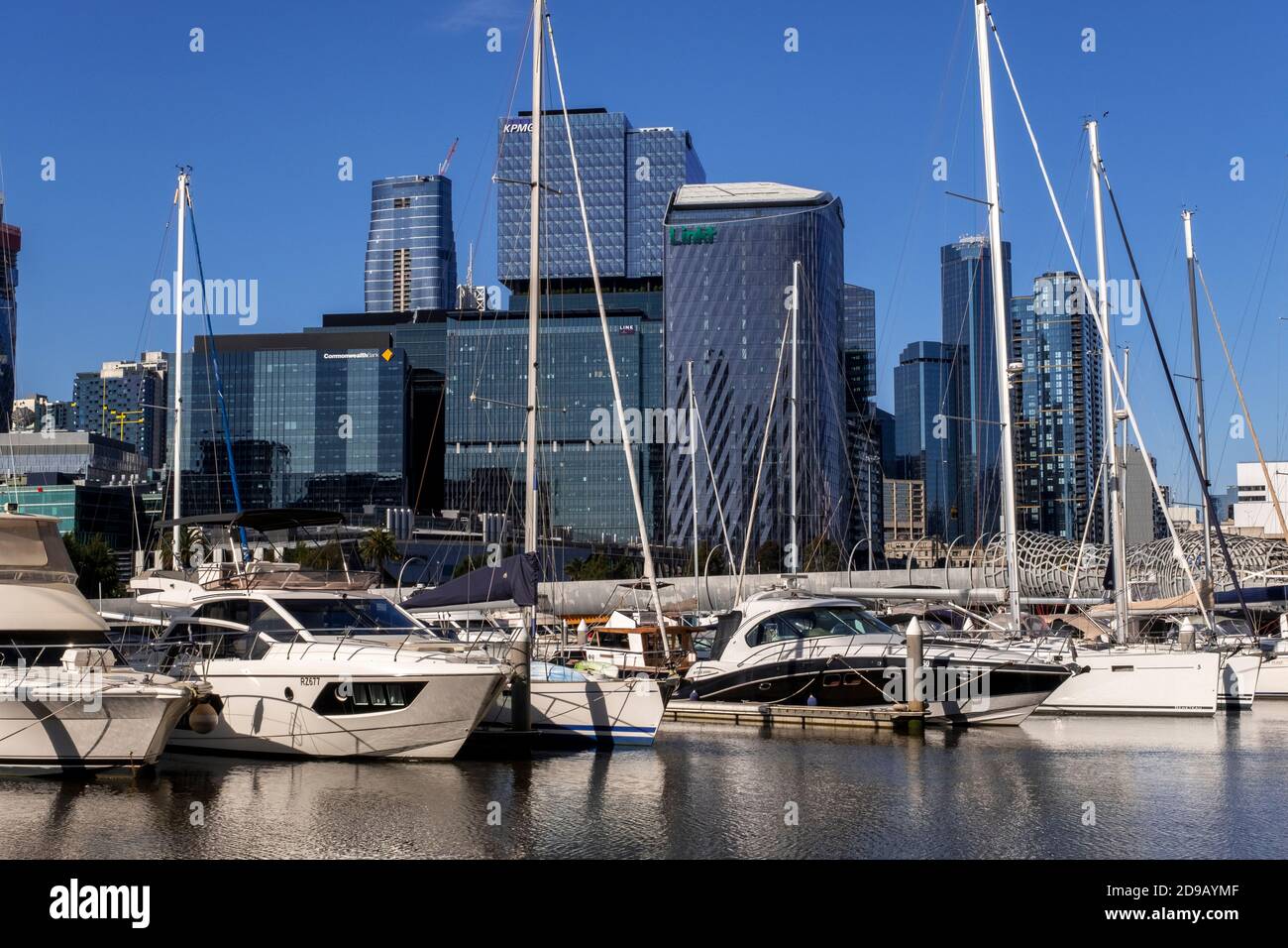 Boats moored at the Yarra's edge marina in front of the Melbourne skyline. Stock Photo