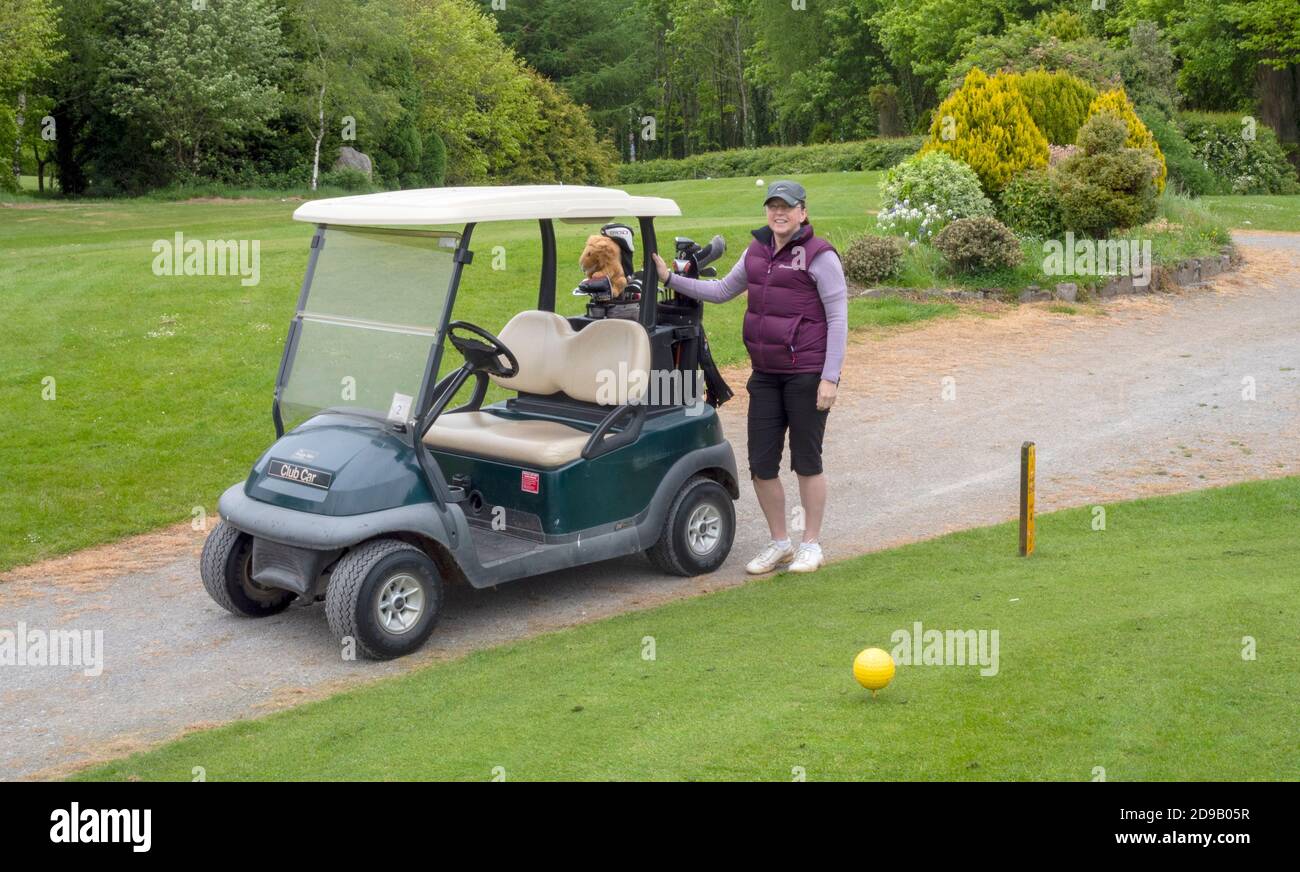 Glasson Golf Club Course, Killinure, Glasson, Co. Westmeath, Ireland. - female golfer with golf buggy Stock Photo