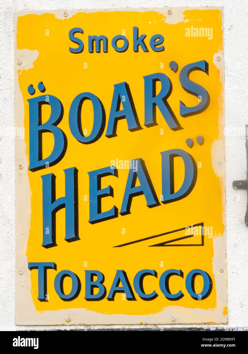 Antique metal wall advertisement sign for Boar's Head Tobacco Stock Photo