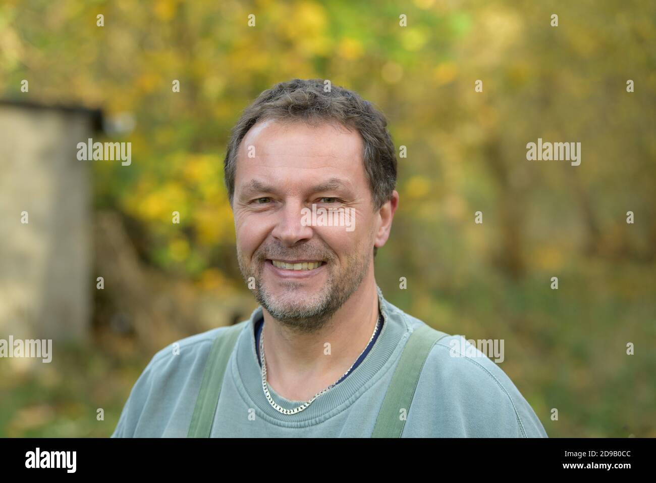 04 November 2020, Brandenburg, Uckerland/Ot Wolfshagen: Steffen Zahn, project manager at the Institute for Inland Fisheries in Potsdam-Sacrow (IFB), is standing on the bank after the release of salmon below the Stepenitz bridge. In total, around 50,000 six-month-old salmon bred at the Denmark Center for Vildlaks for Brandenburg were released in the catchment area of the river Stepenitz. The fish are released in autumn to get used to the water, feed on small crabs and insect larvae, migrate towards the open sea in spring and return to their Brandenburg home after two to three years. The reintro Stock Photo