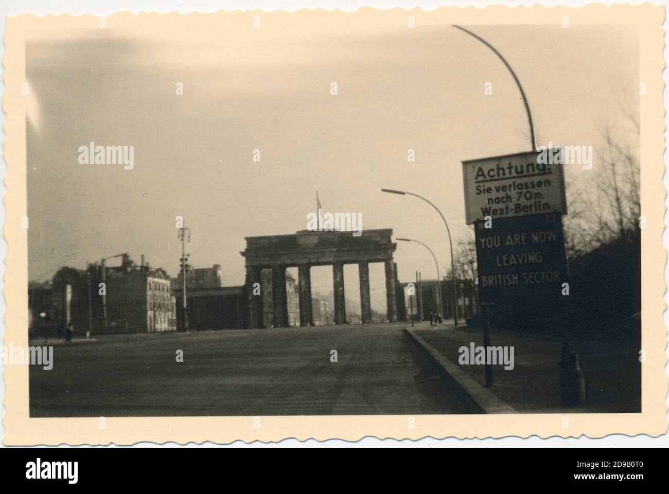 Berlin Germany 1950's memorial - black and white - b/w - brandenburg gate without quadriga but flag - sign British Sector Stock Photo