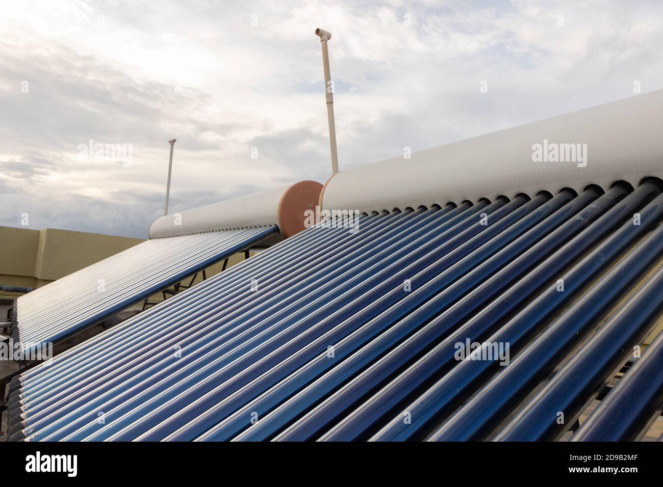 solar panels and tubes installed on roof top of houses and buildings to