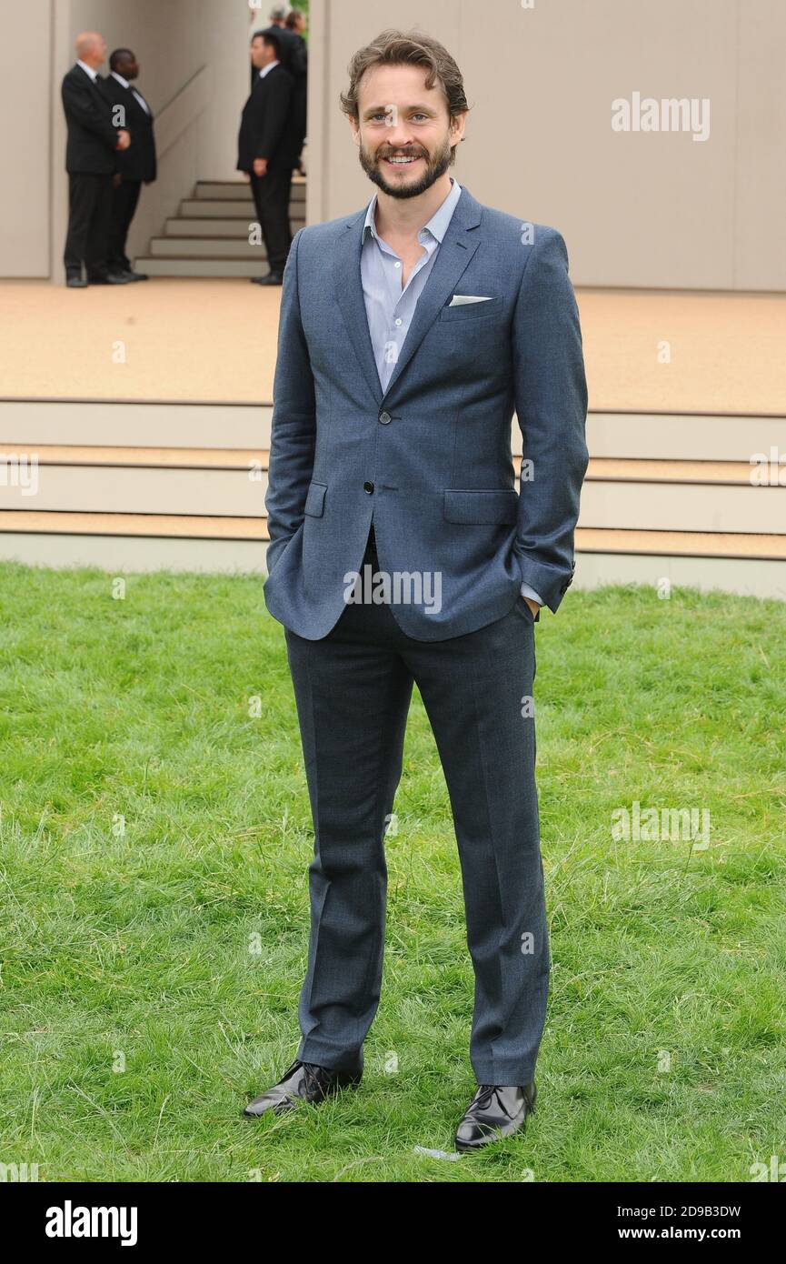 Hugh Dancy attends the Burberry Prorsum Menswear Spring/Summer 2014 catwalk  show, Perks Field, Kensington Gardens, London. © Paul Treadway Stock Photo  - Alamy