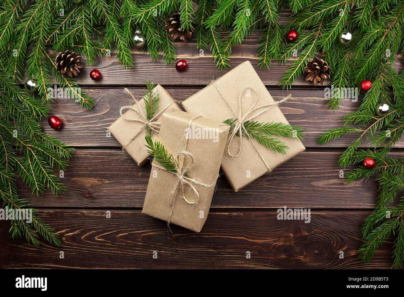 Christmas and New Year gift boxes with fir tree branches, cones and ...