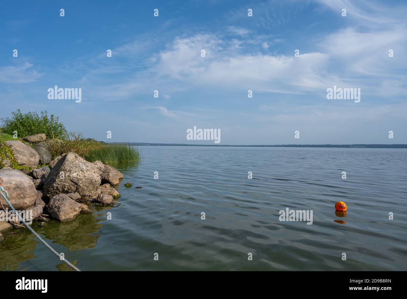 Beautiful scenery at a lake one of the latest days of summer. Picture from Ringsjon, Scania, southern Sweden. Blue sky meets blue water Stock Photo