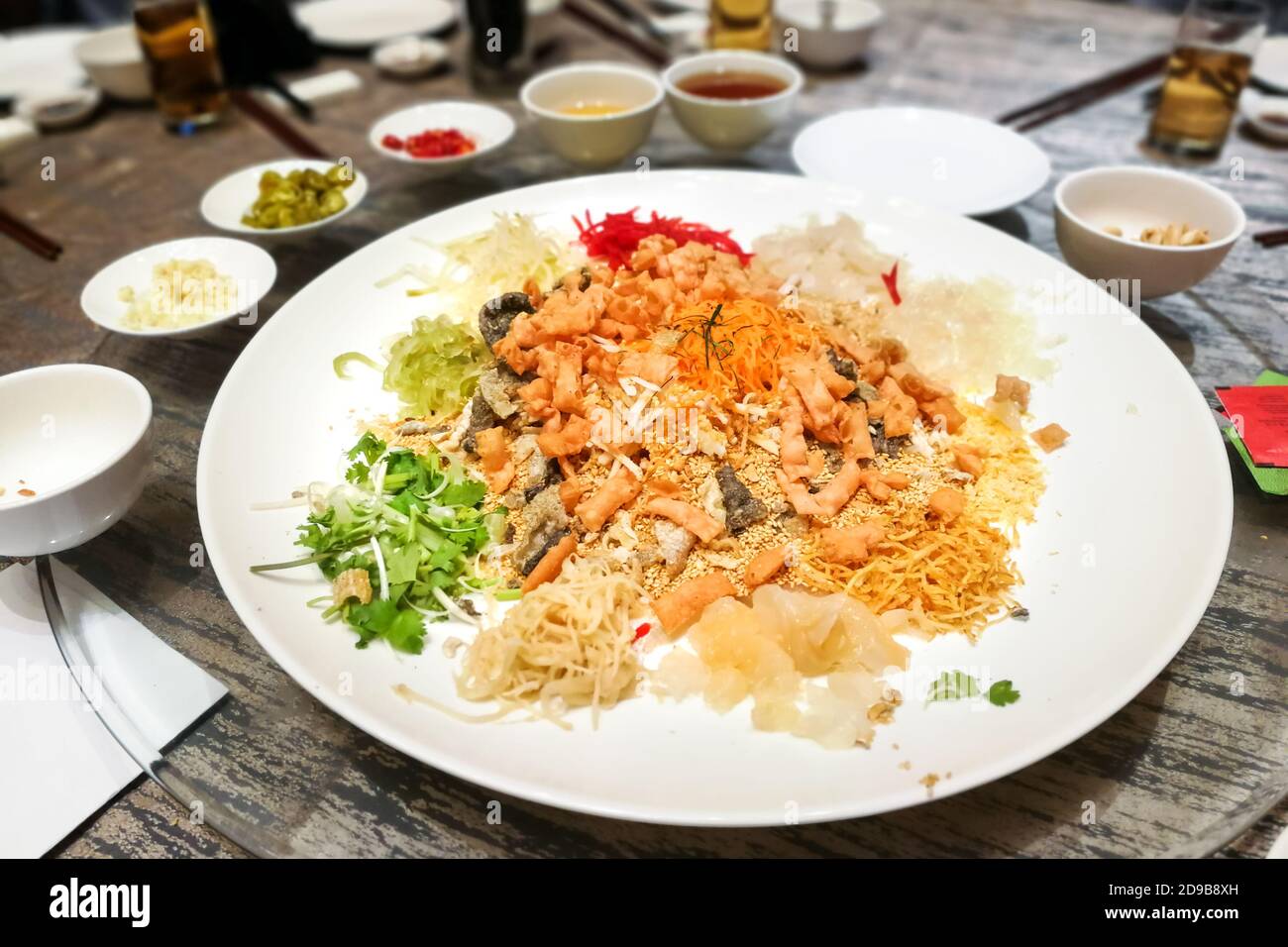 Serving of Yee Sang or Yusheng during Chinese New Year Stock Photo