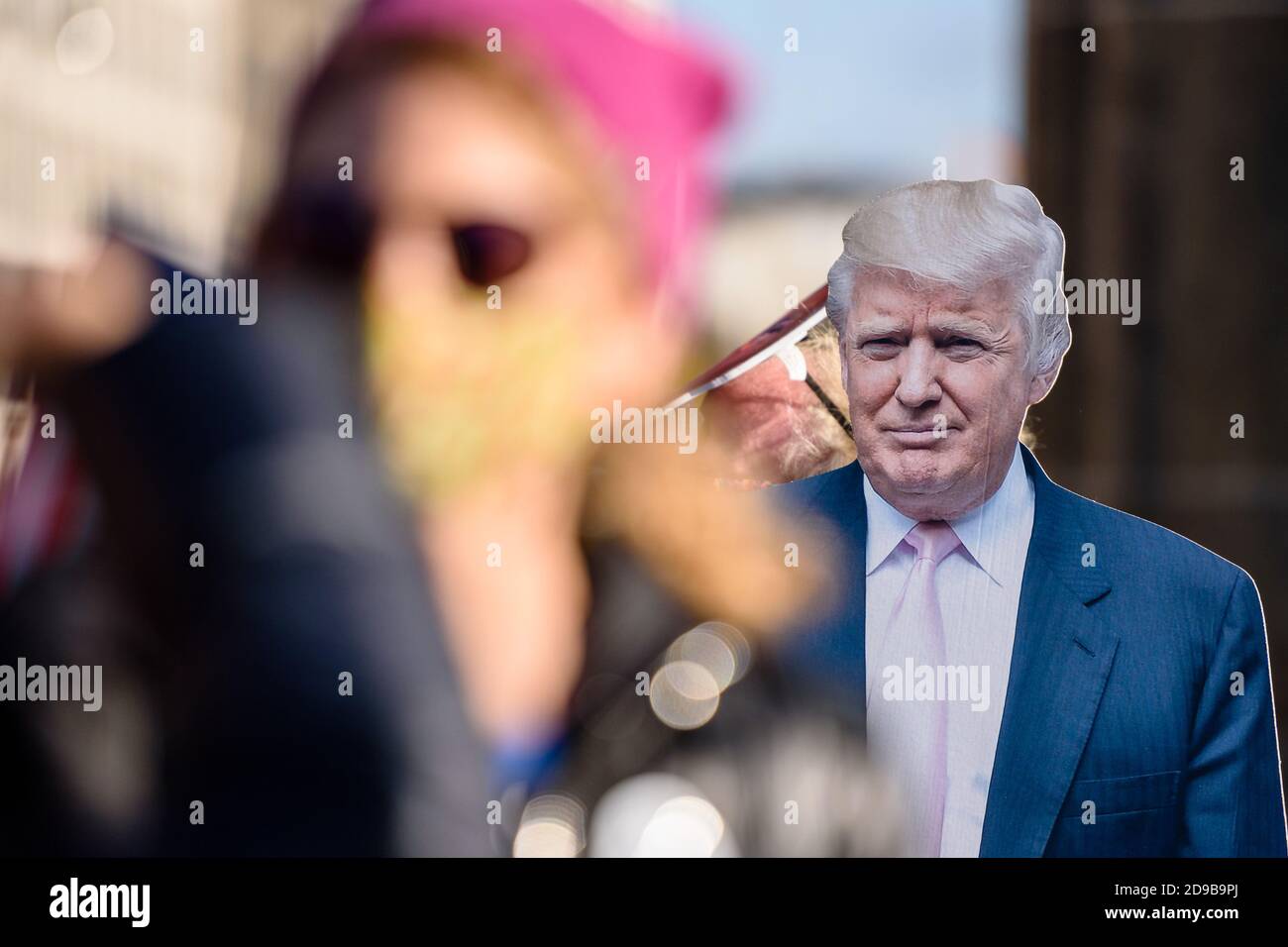 Germany, Berlin, November 04, 2020: A cardboard figure of Donald Trump, 45th and current president of the United States, can be seen behind protesters and supporters of Democratic presidential candidate former Vice President JOE BIDEN next to the Brandenburg Gate in Central Berlin during a rally unter the motto 'Count the Votes! Rally for Fair Elections in the USA' organized by the Democrats Abroad, the official organization of the Democratic Party for United States citizens living permanently or temporarily outside the United States, during the pending final vote count for the 2020 United Sta Stock Photo