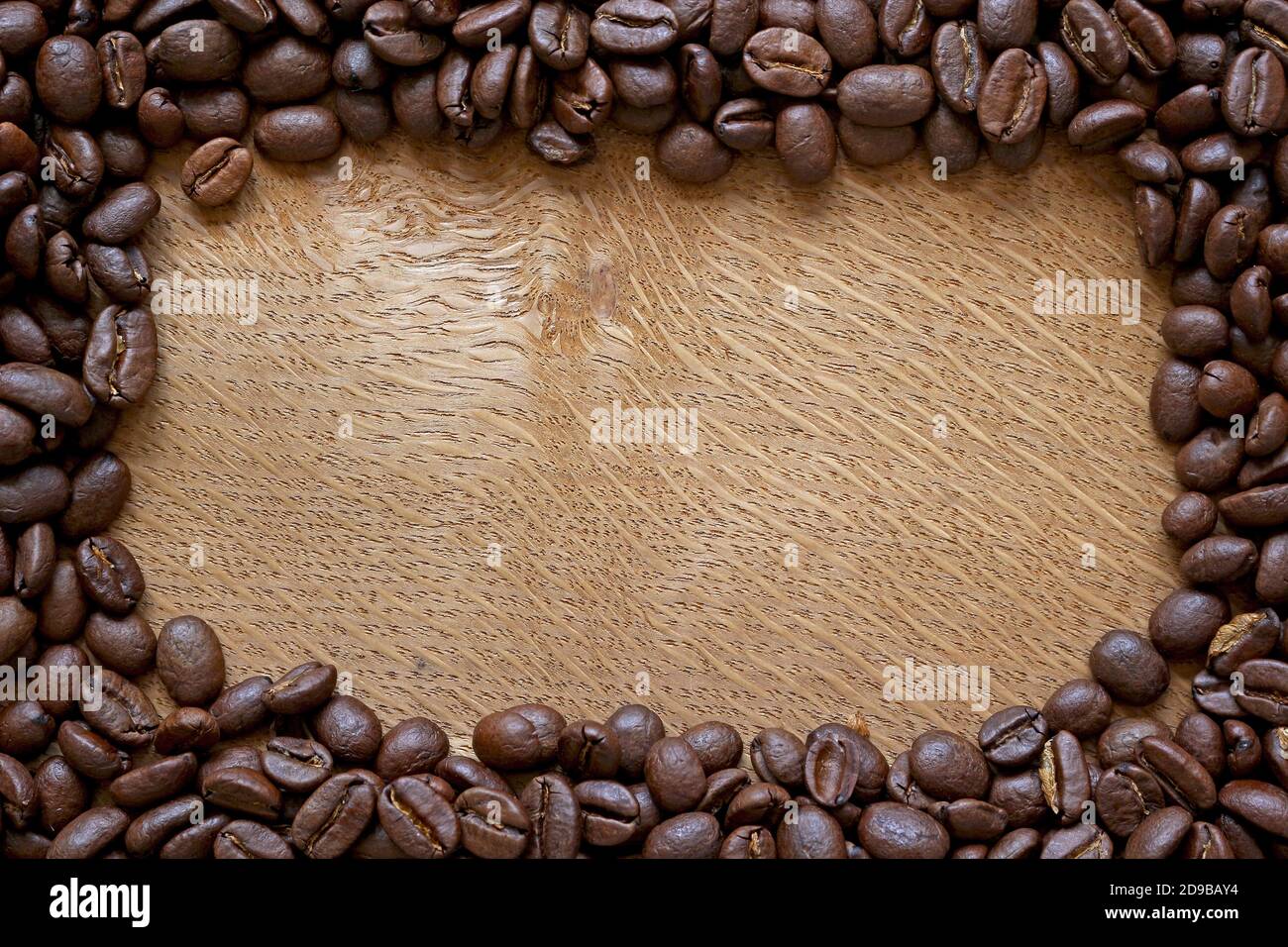 coffee beans border on wooden background Stock Photo