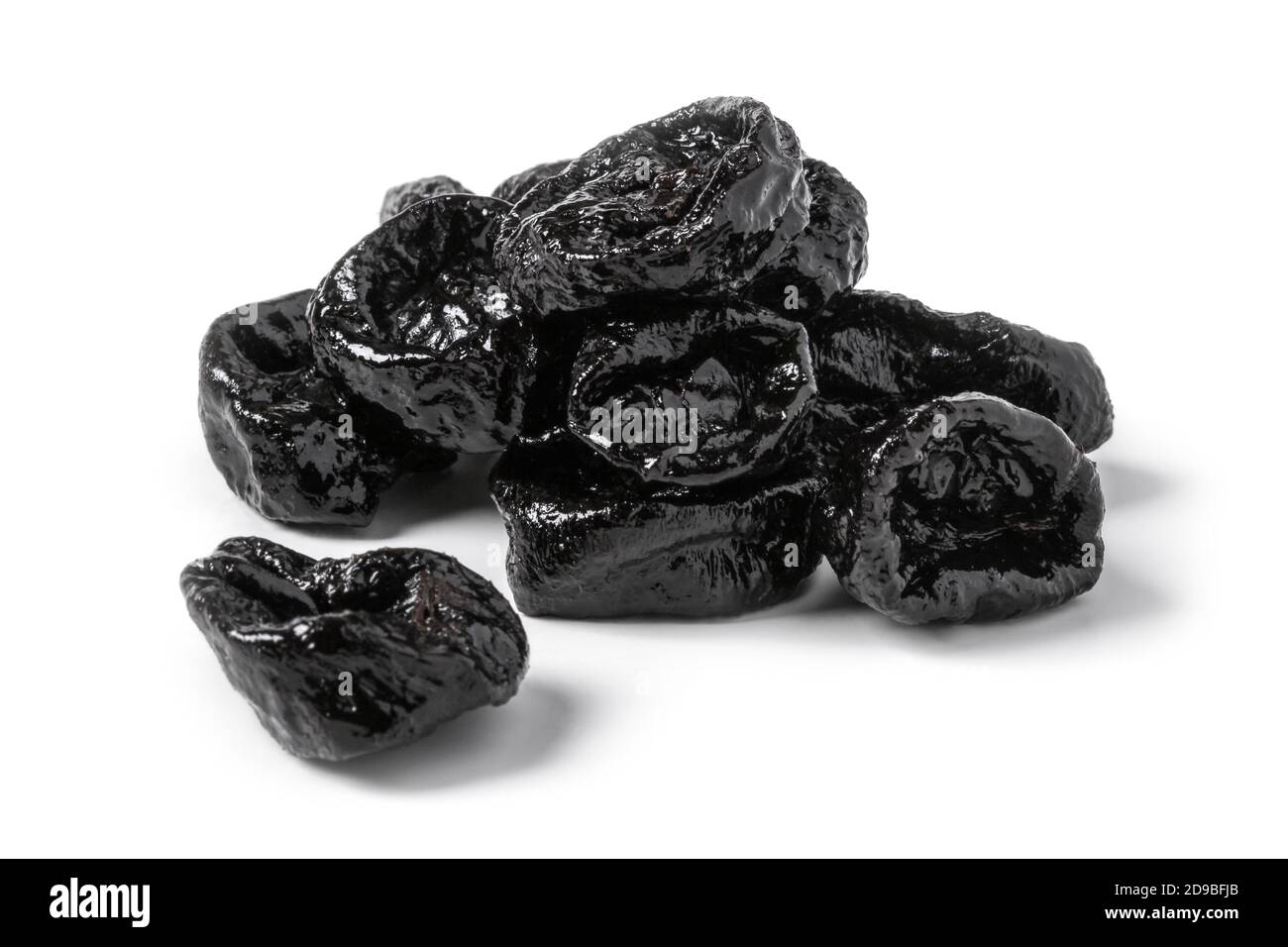 Dried prunes close up on white background Stock Photo