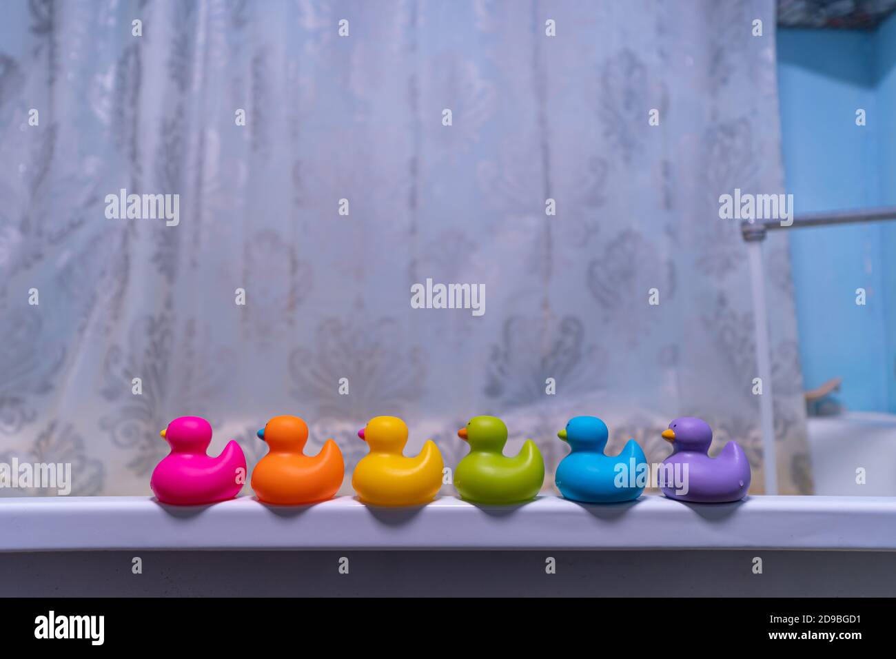 rubber toys in the bathroom, yellow duck and bath decor elements Stock Photo