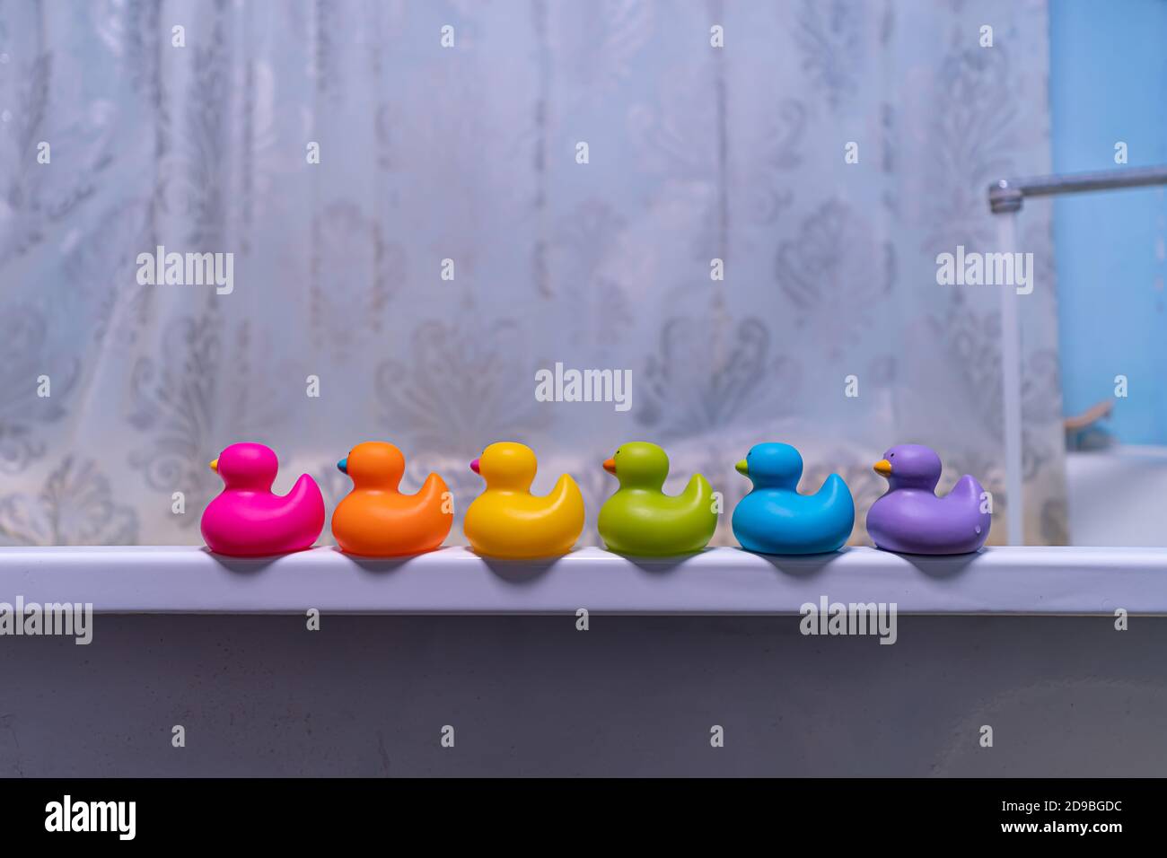 rubber toys in the bathroom, yellow duck and bath decor elements Stock Photo