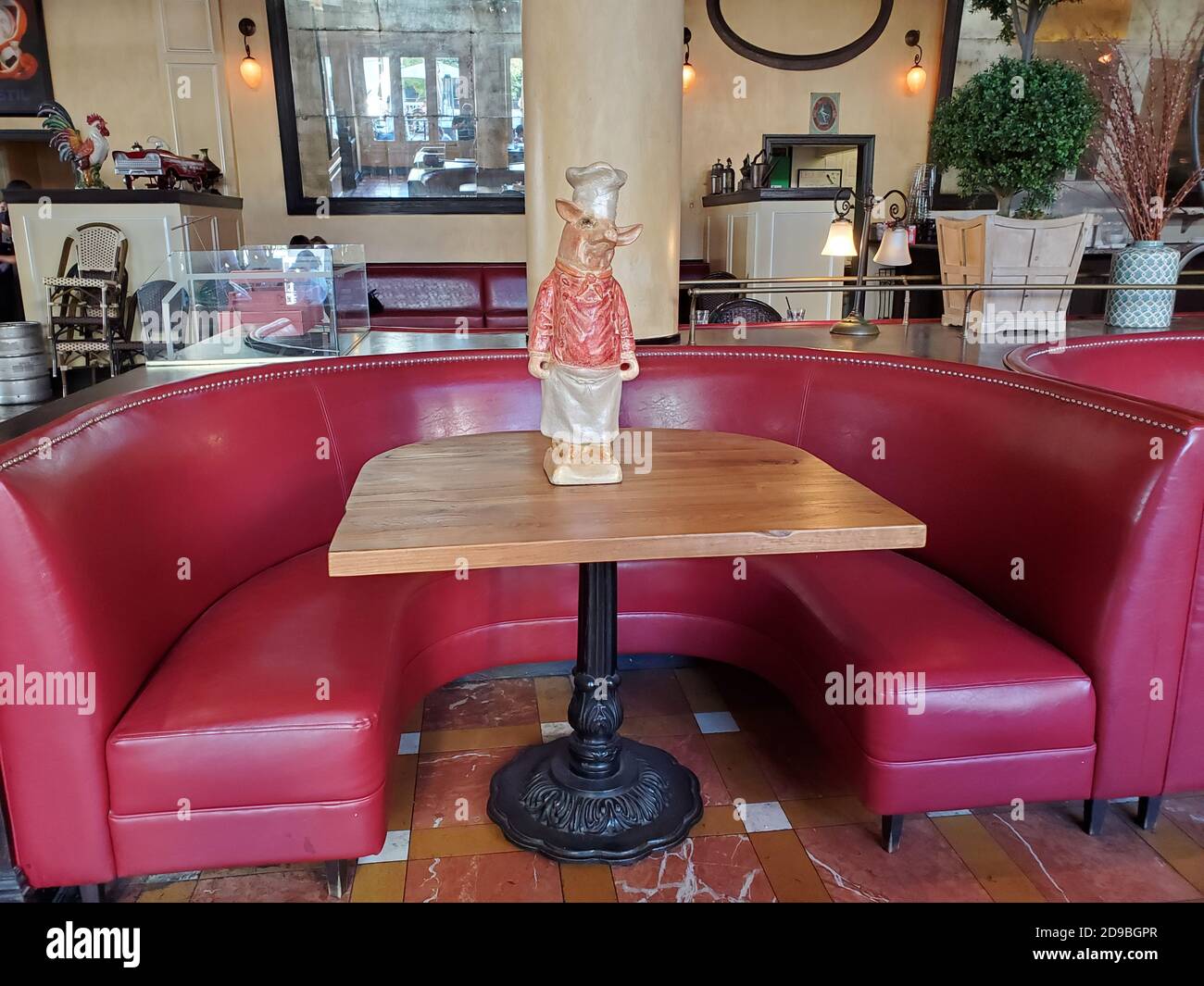 At a restaurant in San Jose, California, a ceramic pig statue is being