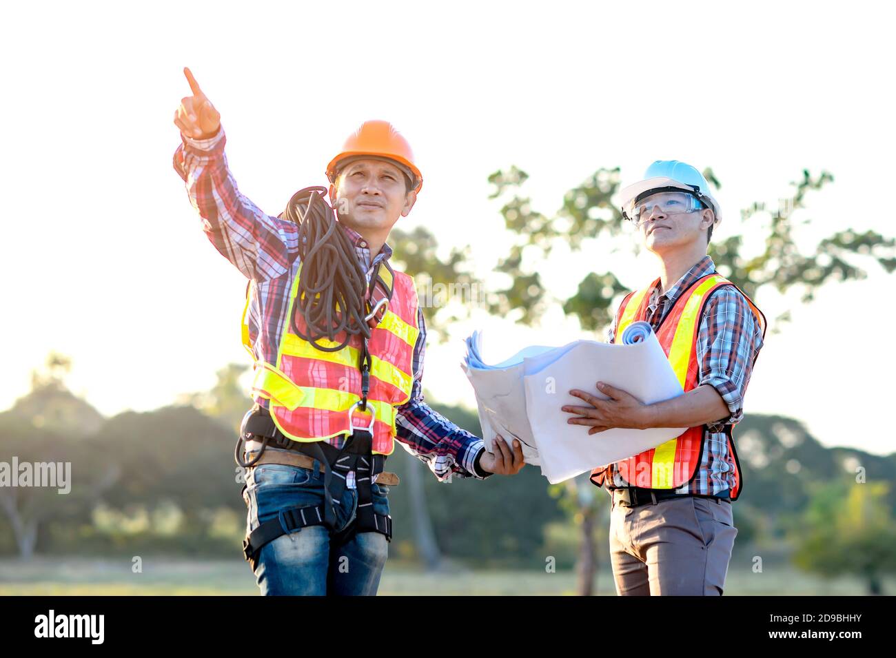 Two construction workers on a building site, Thailand Stock Photo