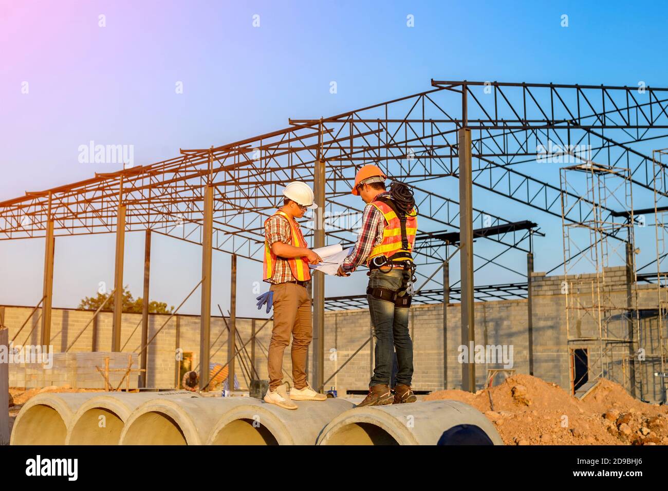 Two construction workers on a building site, Thailand Stock Photo