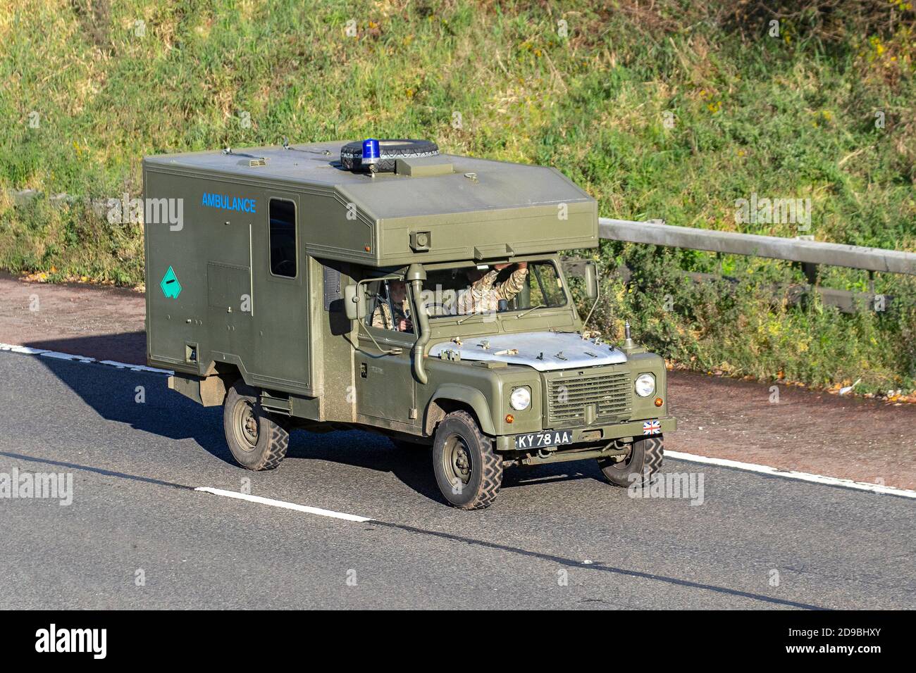 British Army military ambulance vehicles in Preston, Lancashire. UK Army vehicles & green Land Rover en-route to Liverpool citywide Test & Trace. Stock Photo