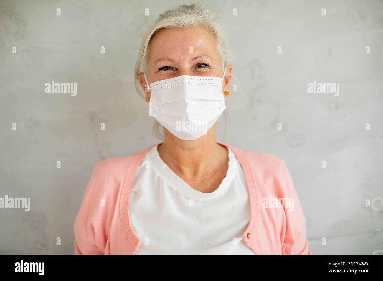 Mature woman wearing facial mask hi-res stock photography and images ...