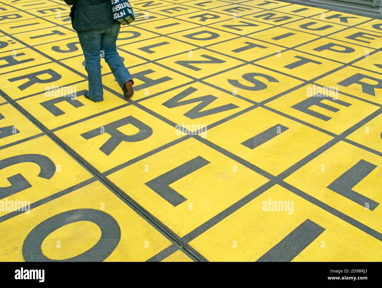 walking on field of letters outside the Berlin Gallery National Museum of Modern Art Kreuzberg, Berlin Stock Photo