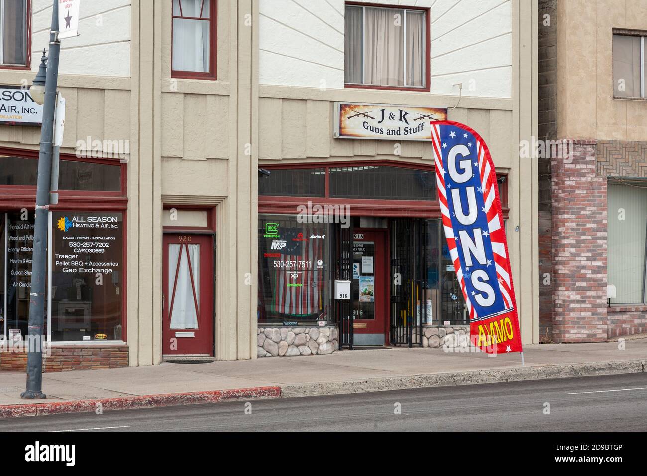SUSANVILLE, CA - MARCH 31, 2020 - Having been deemed an essential service by President Trump and local authorities, a gun store remains open. Stock Photo