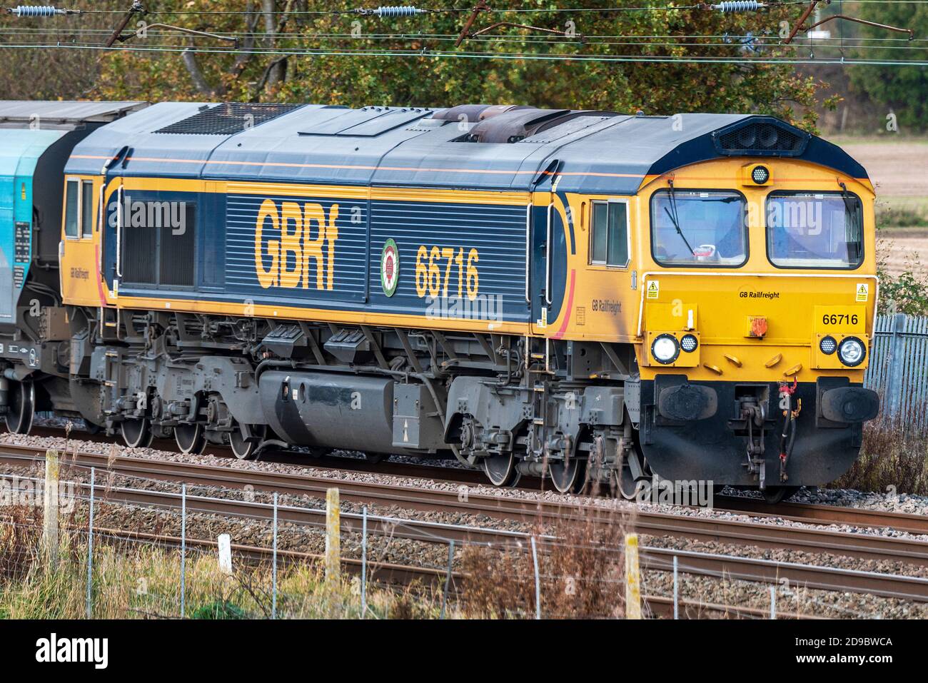 GBRF freight diesel electric locomotive class 66 number 66716 at Winwick on the West Coast Main Line. 66716 was named to commemorate the Centenary of Stock Photo