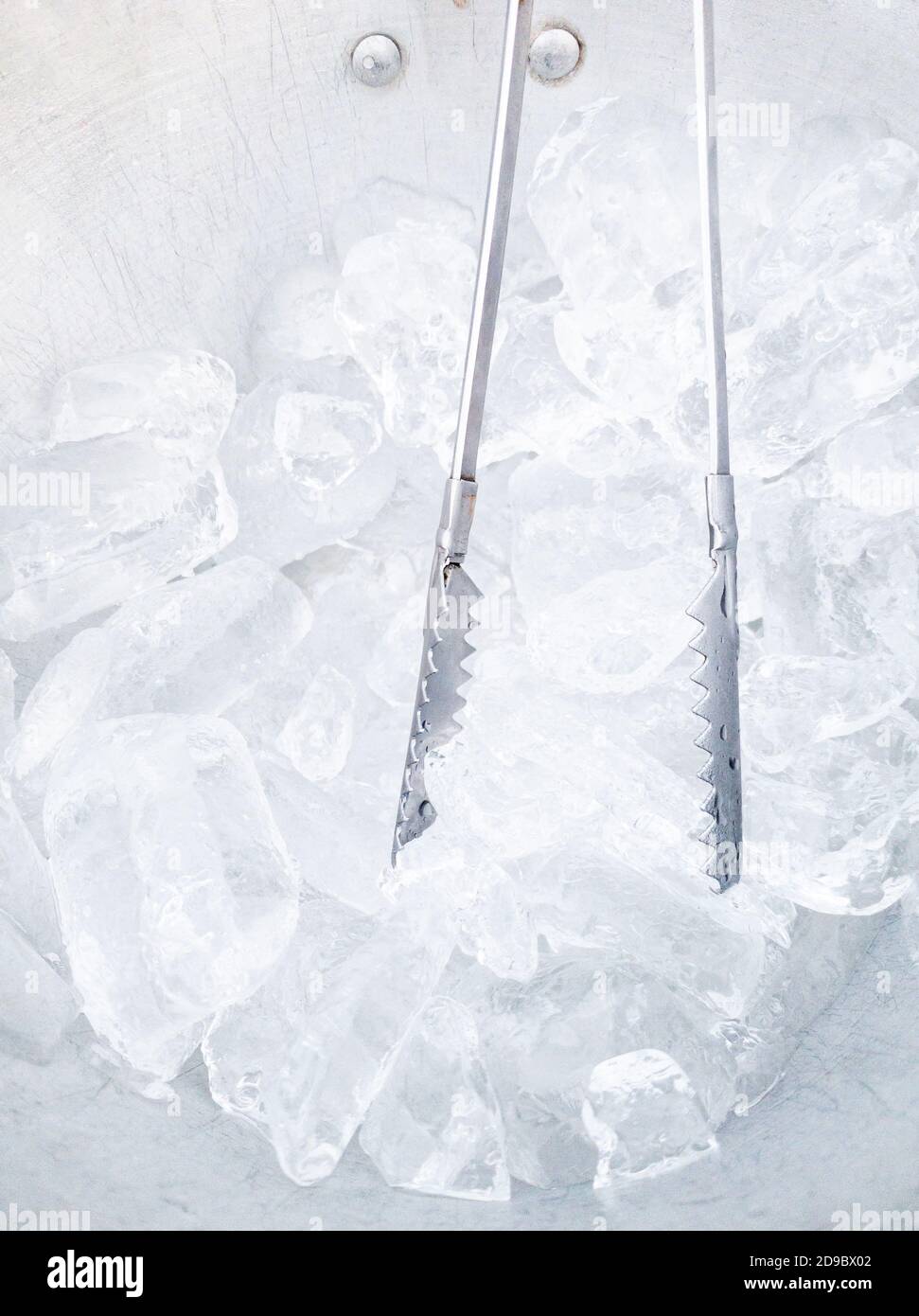 Big Ice Cube In Ice Tongs Over The Bucket On The Table Stock Photo -  Download Image Now - iStock