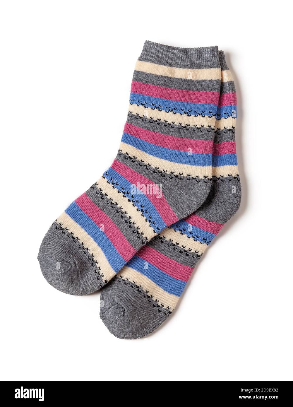 Pair of tall striped socks isolated on a white background. Gray socks with white, blue, pink stripes. Hosiery for the cold winter season. Stock Photo