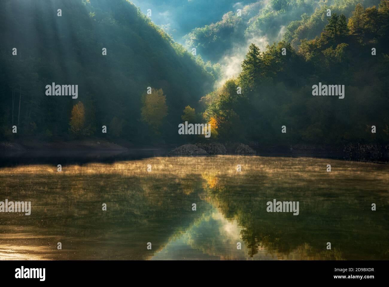 a misty morning on the lake of Gramolazzo, just below the apuan peaks, in the Garfagnana valley of Tuscany Stock Photo