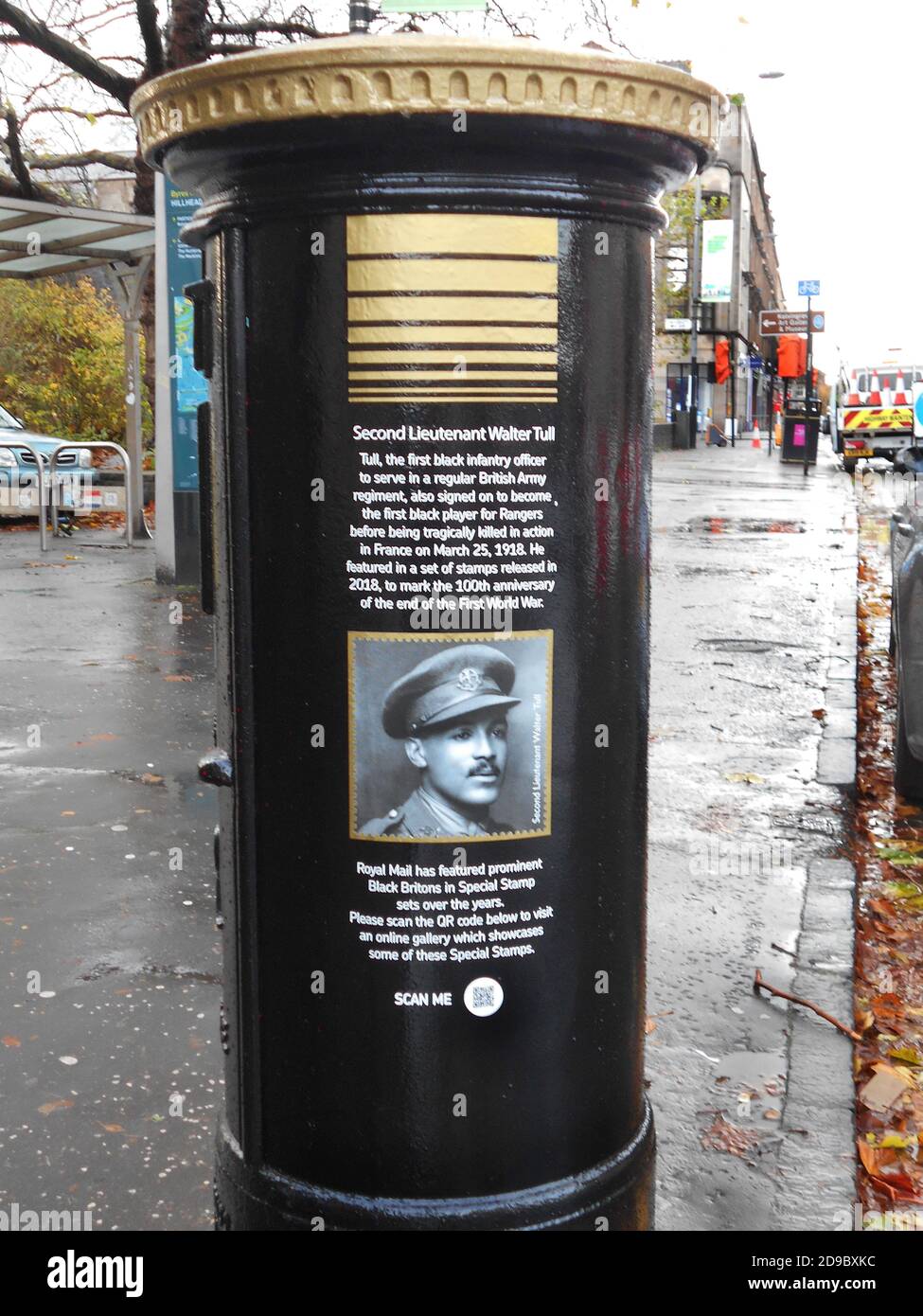 This Royal Mail post box, in Glasgow, has been painted black and gold to celebrate Black History month, October 2020. It is a tribute to Walter Tull, who was the 1st black officer in the regular British Army. He was also signed up to play for Rangers football team before being killed in action, in France, on the 25th March 1918. This is the inscription on the post box along with a picture of Walter Tull. ALAN WYLIE/ALAMY© Stock Photo