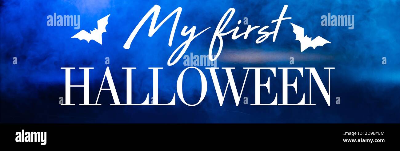 my first halloween lettering on blue dark background with smoke, banner Stock Photo