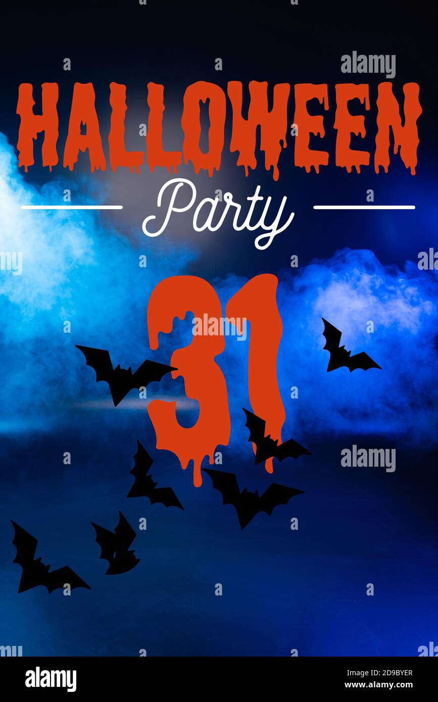 Halloween party lettering on blue background with smoke Stock Photo