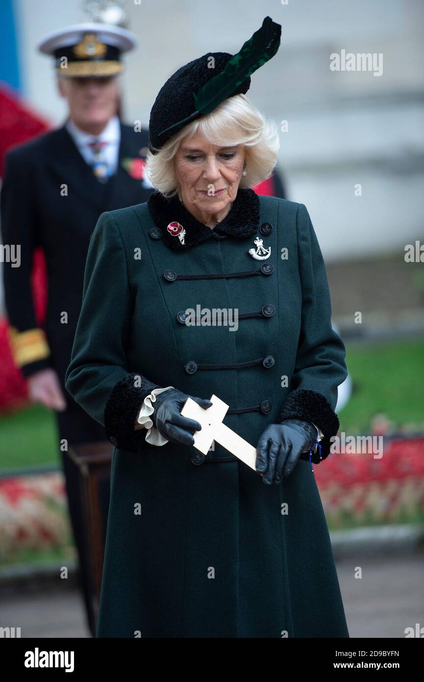 The Duchess of Cornwall, Patron of The Poppy Factory, has paid tribute to BritainÕs war dead by placing a cross in Westminster AbbeyÕs Field of Remembrance, in its 92nd year, at Westminster Abbey in London, ahead of Armistice Day. Stock Photo