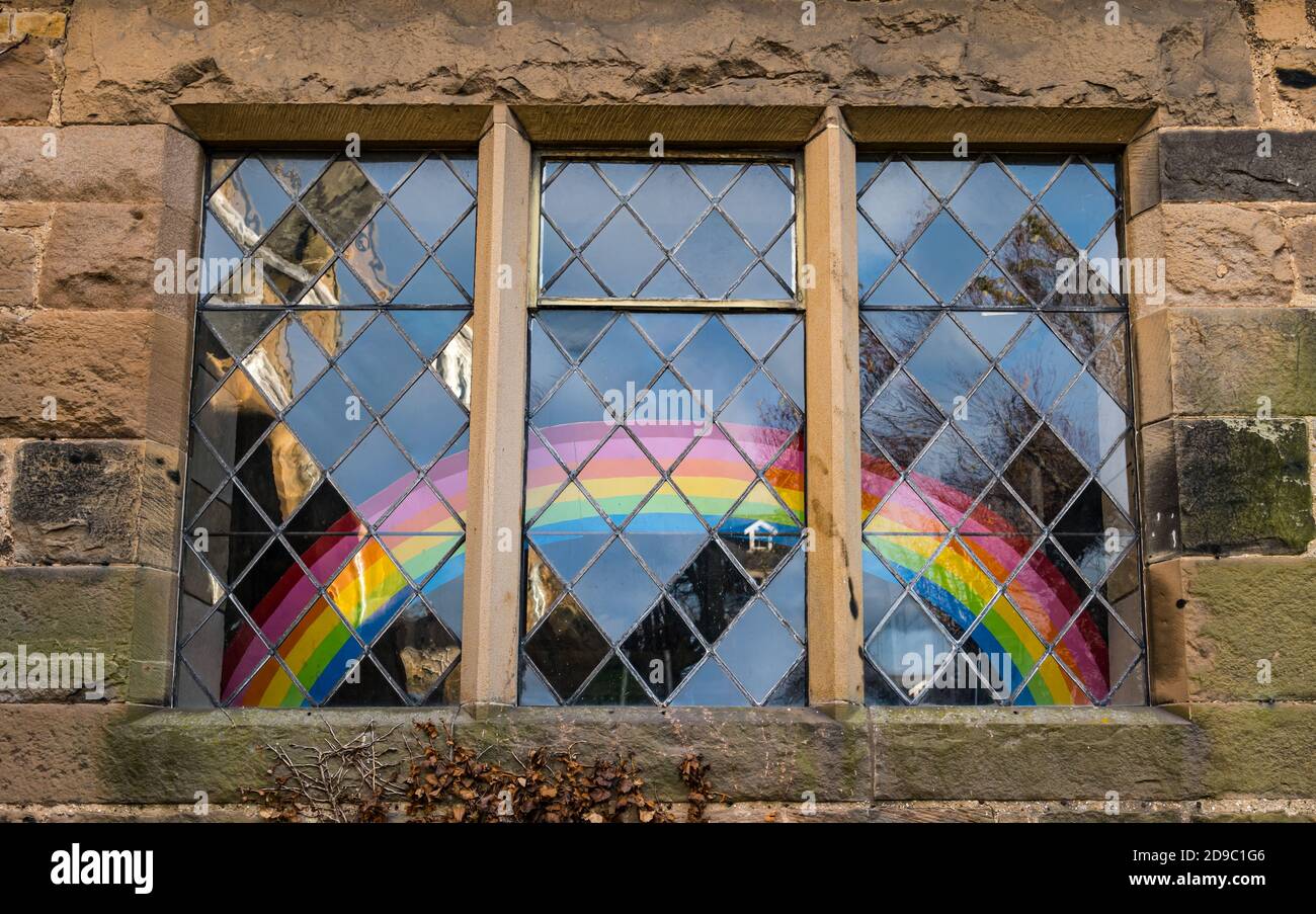 Rainbow in lattice window of Chalmers Memorial Church during Covid-19 pandemic, Port Seton, East Lothian, Scotland, UK Stock Photo
