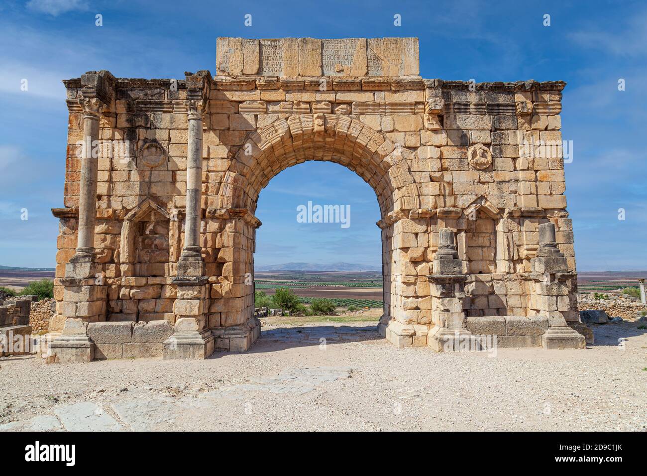 The Triumphal Arch devoted to Emperor Caracalla at the 3rd Century Ruins at Volubilis morocco Stock Photo