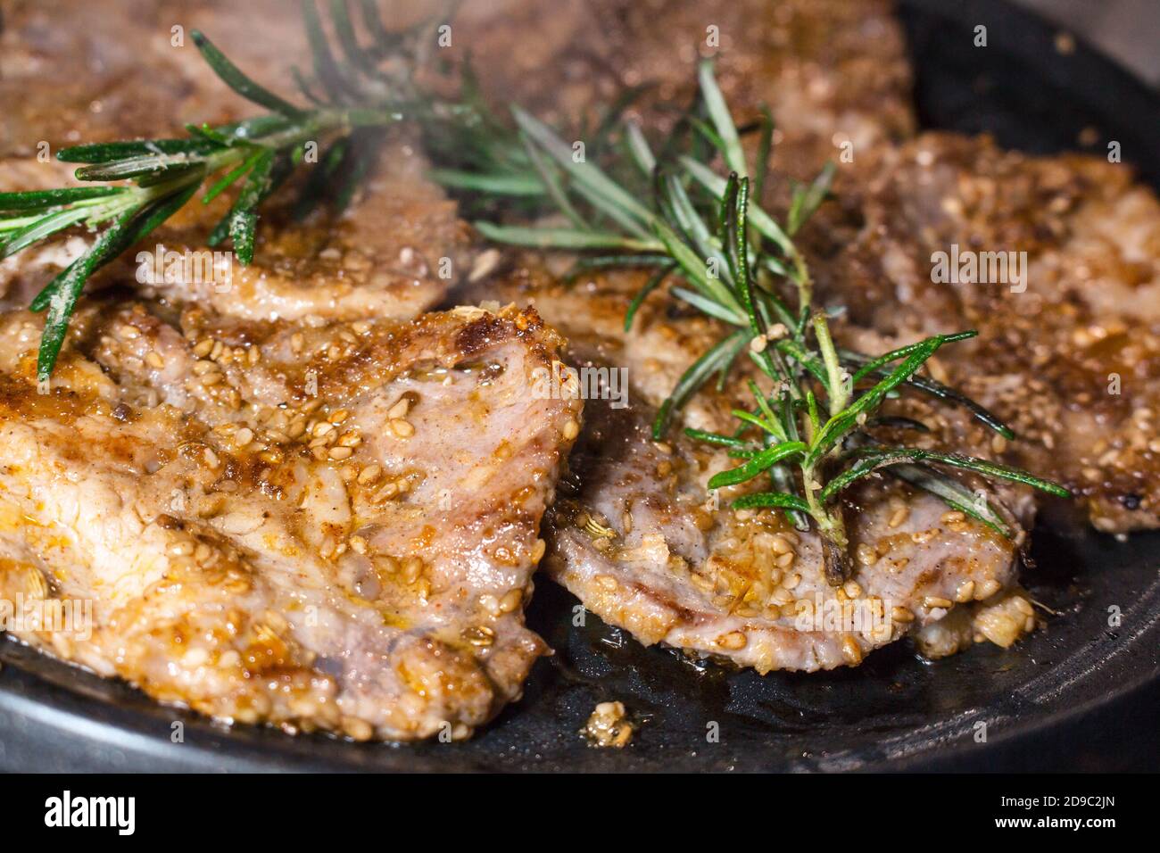 Japanese-style grilled pork slices with sesame, ginger and soy sauce Stock Photo