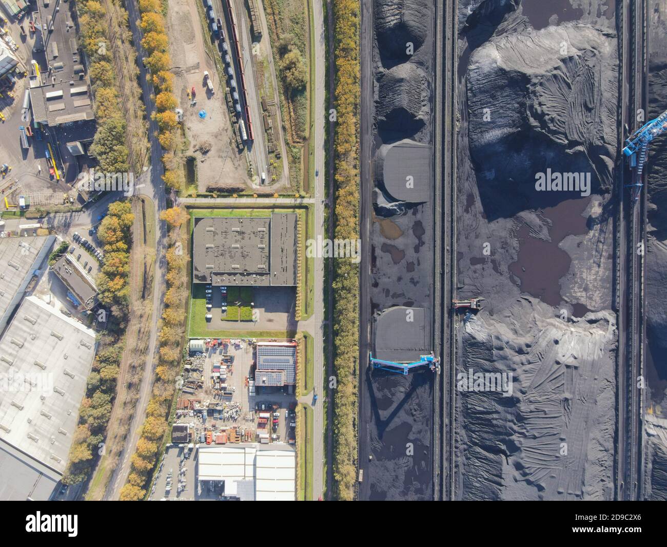 Coal storage place energy consumption piles of black coal Stock Photo