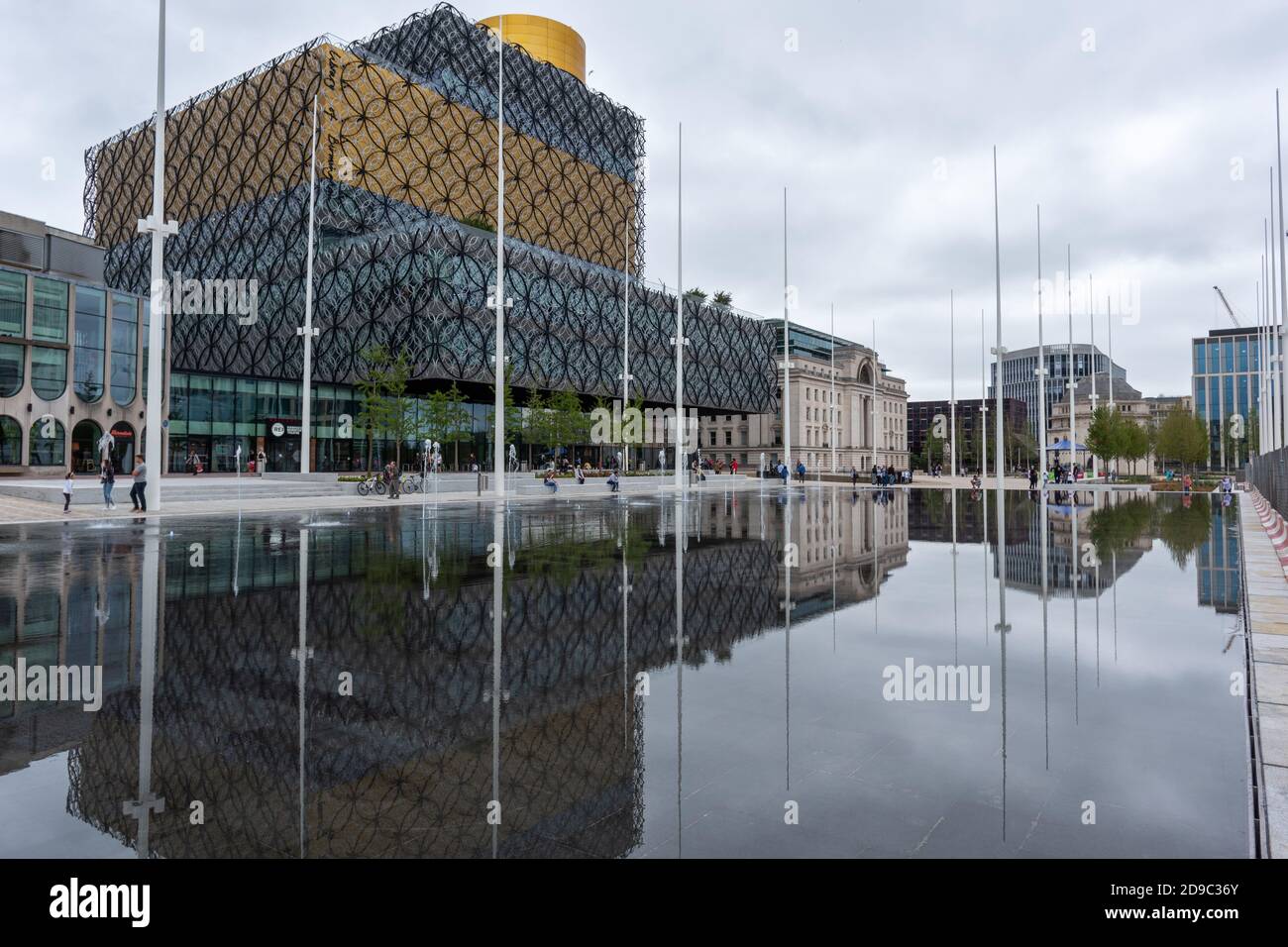 Flagpoles reflected in the water, Centenary Square, Birmingham Stock Photo