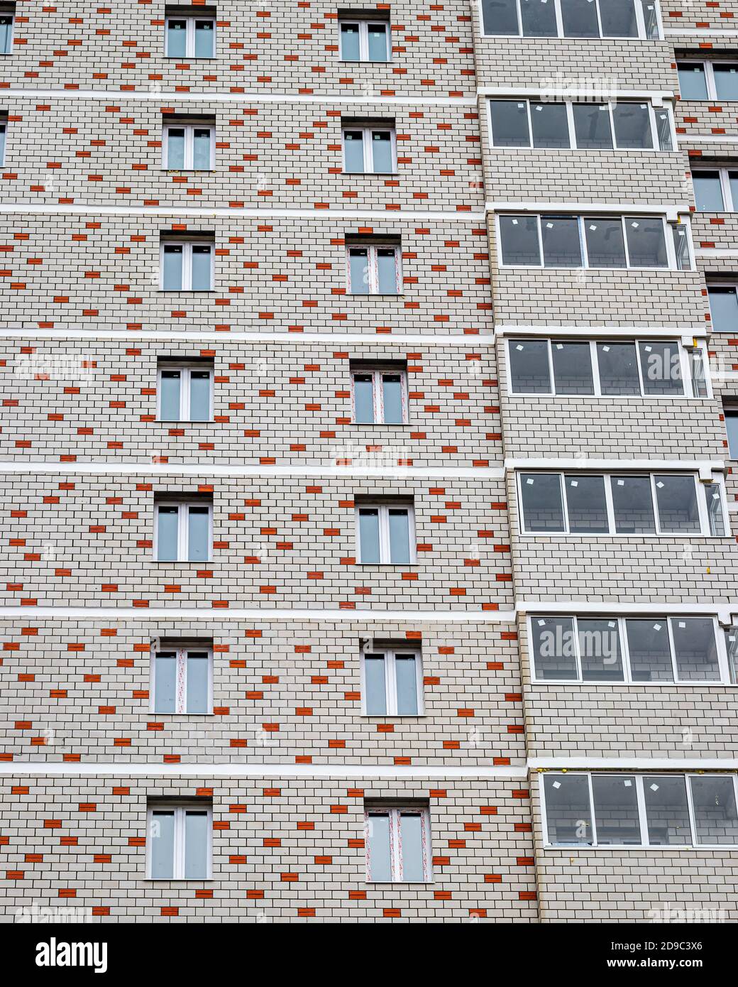 Fragment of the brick residential building with balconies Stock Photo ...