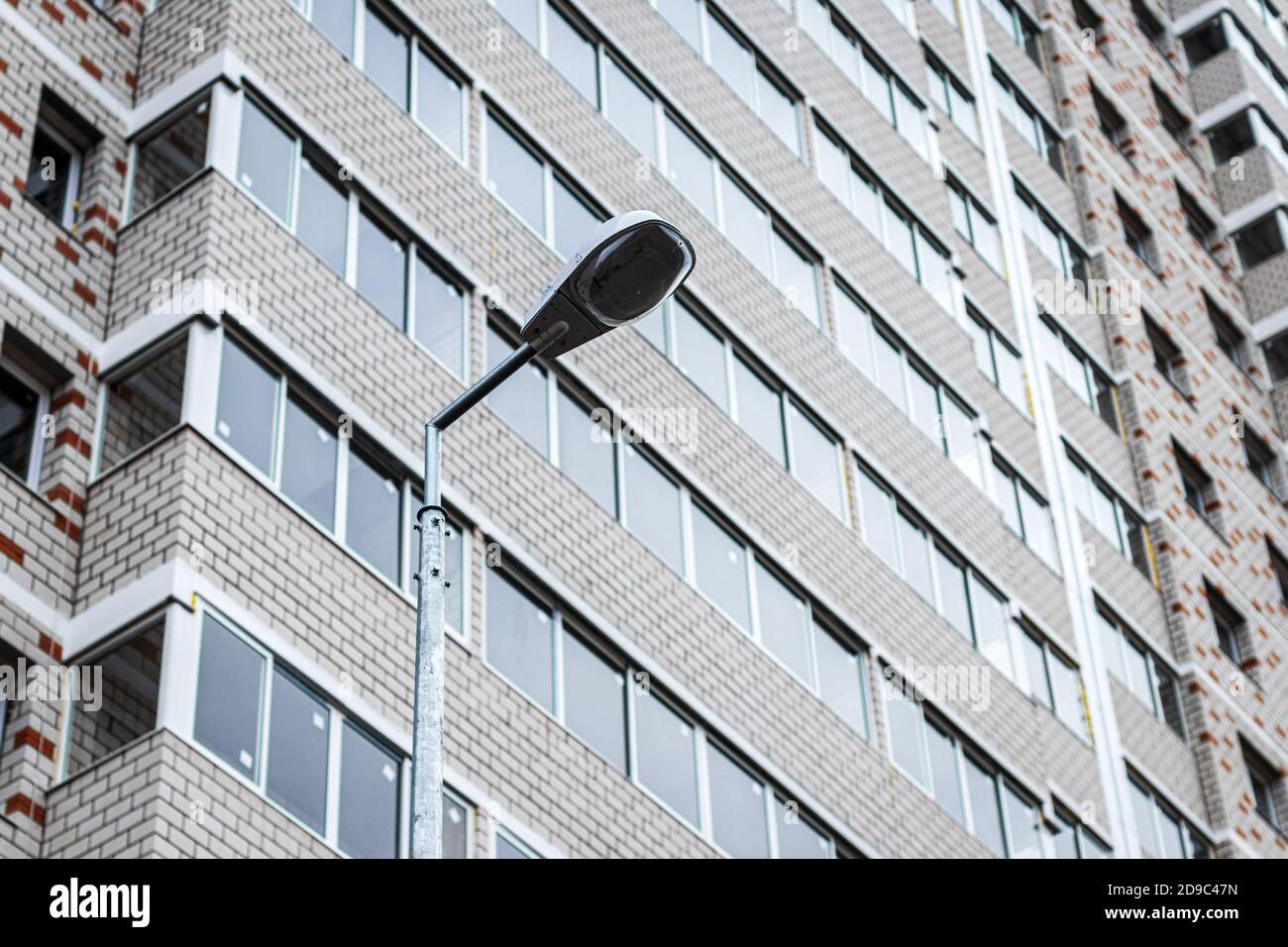 Fragment of the brick residential building with balconies Stock Photo ...