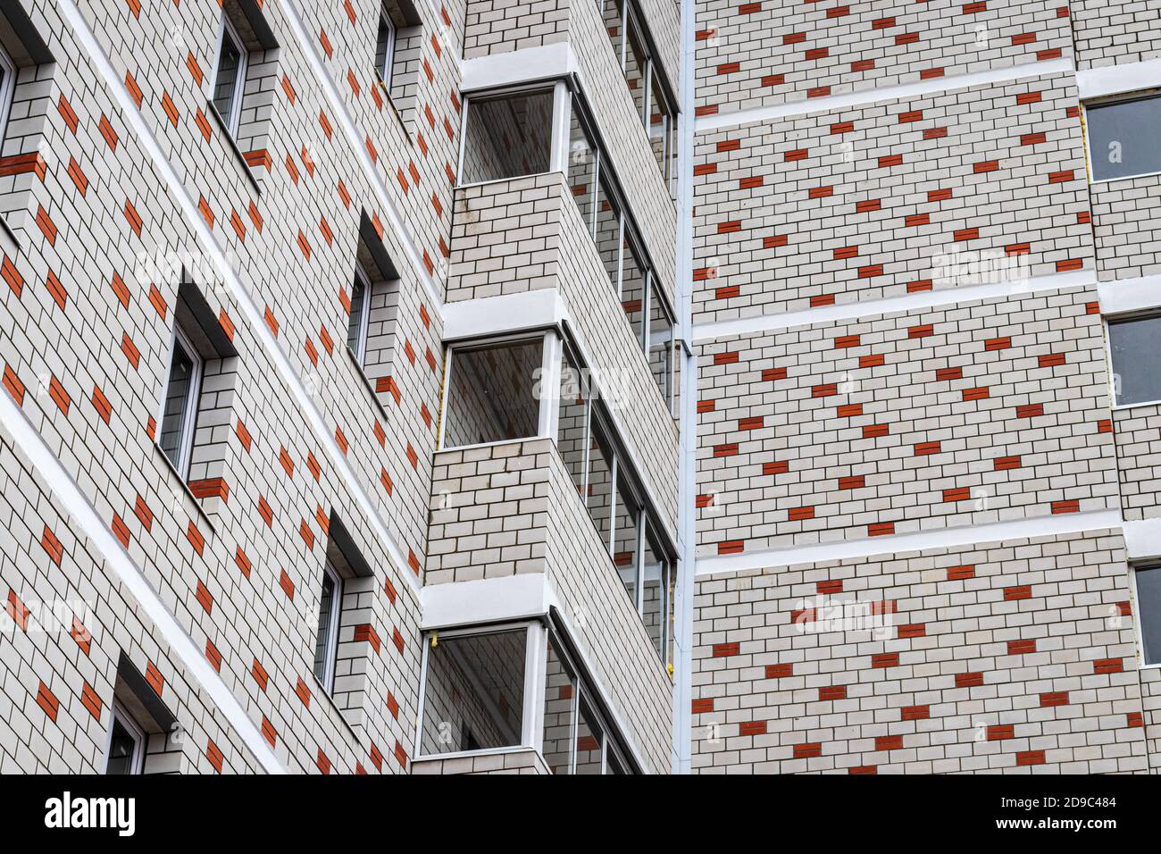 Fragment of the brick residential building with balconies Stock Photo ...