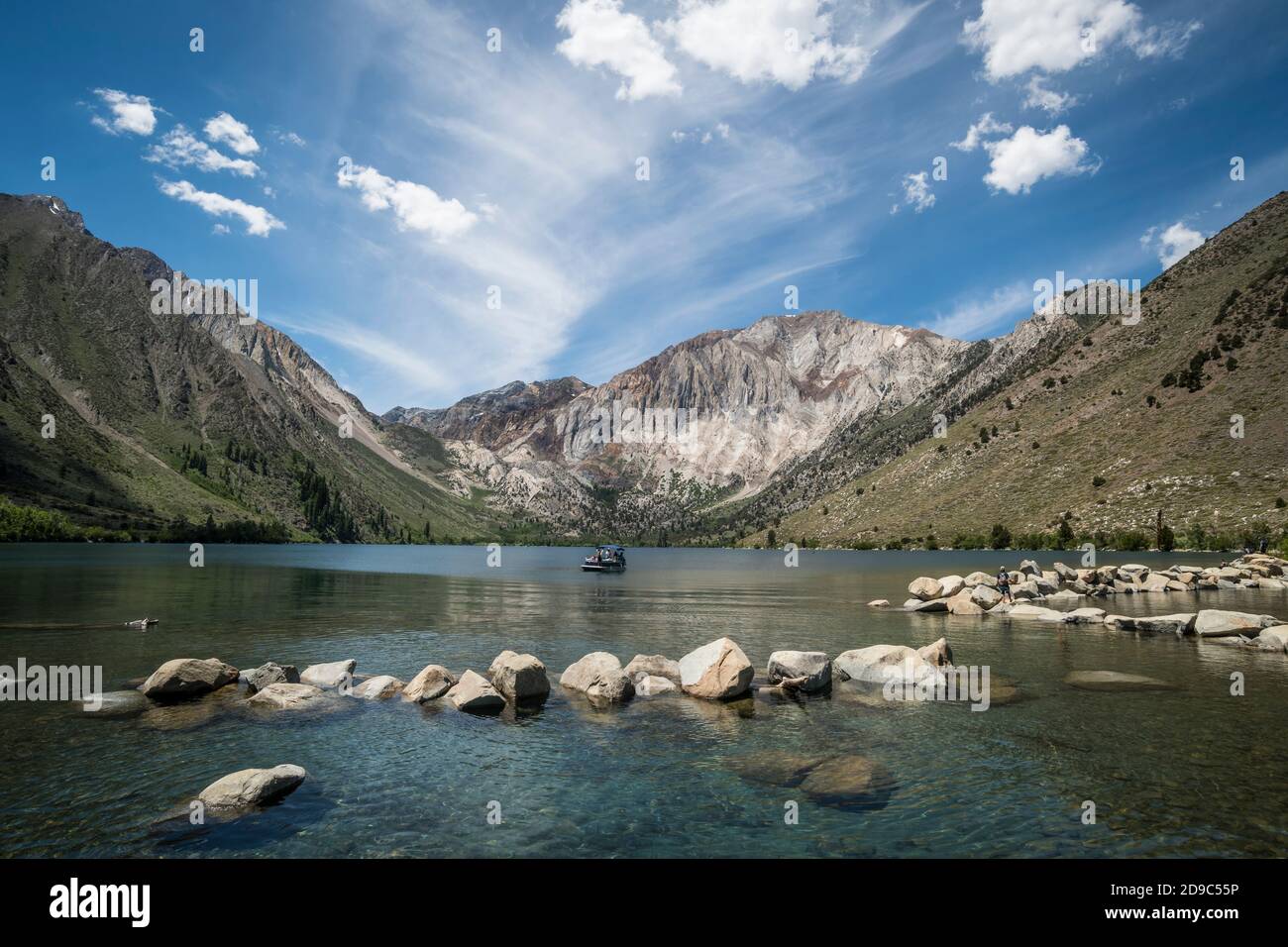 A beautiful mountain lake in the Seirra Nevada mountains is covered by a unique cloud formation. Stock Photo