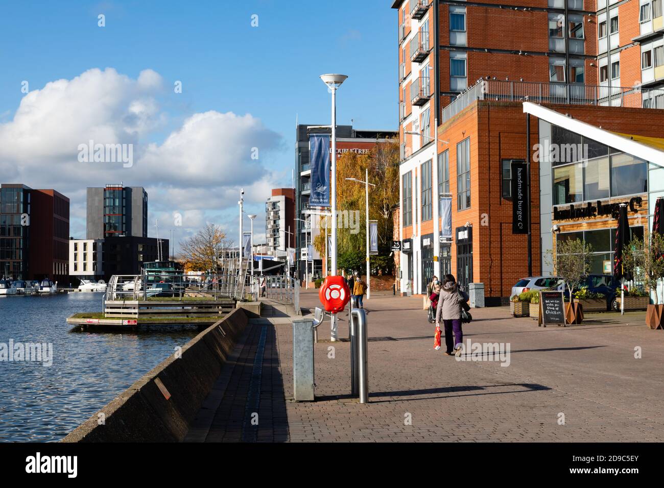 Brayford Wharf and shops with people, Lincoln, Lincolnshire, England, United Kingdom. Stock Photo