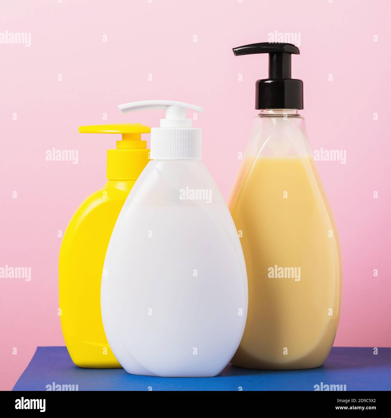 Disinfectants and liquid soap on a pink background Stock Photo Alamy