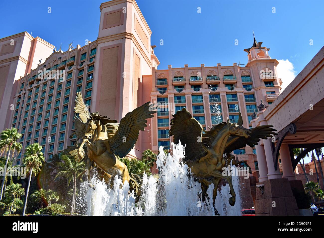The main entrance to the Atlantis resort on Paradise Island, Bahamas. The Pegasus fountain with the Royal Tower, containing hotel rooms behind. Stock Photo
