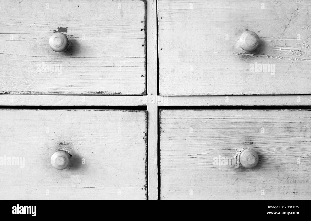 Furniture detail shot of vintage old white wooden chest of drawers background texture Stock Photo