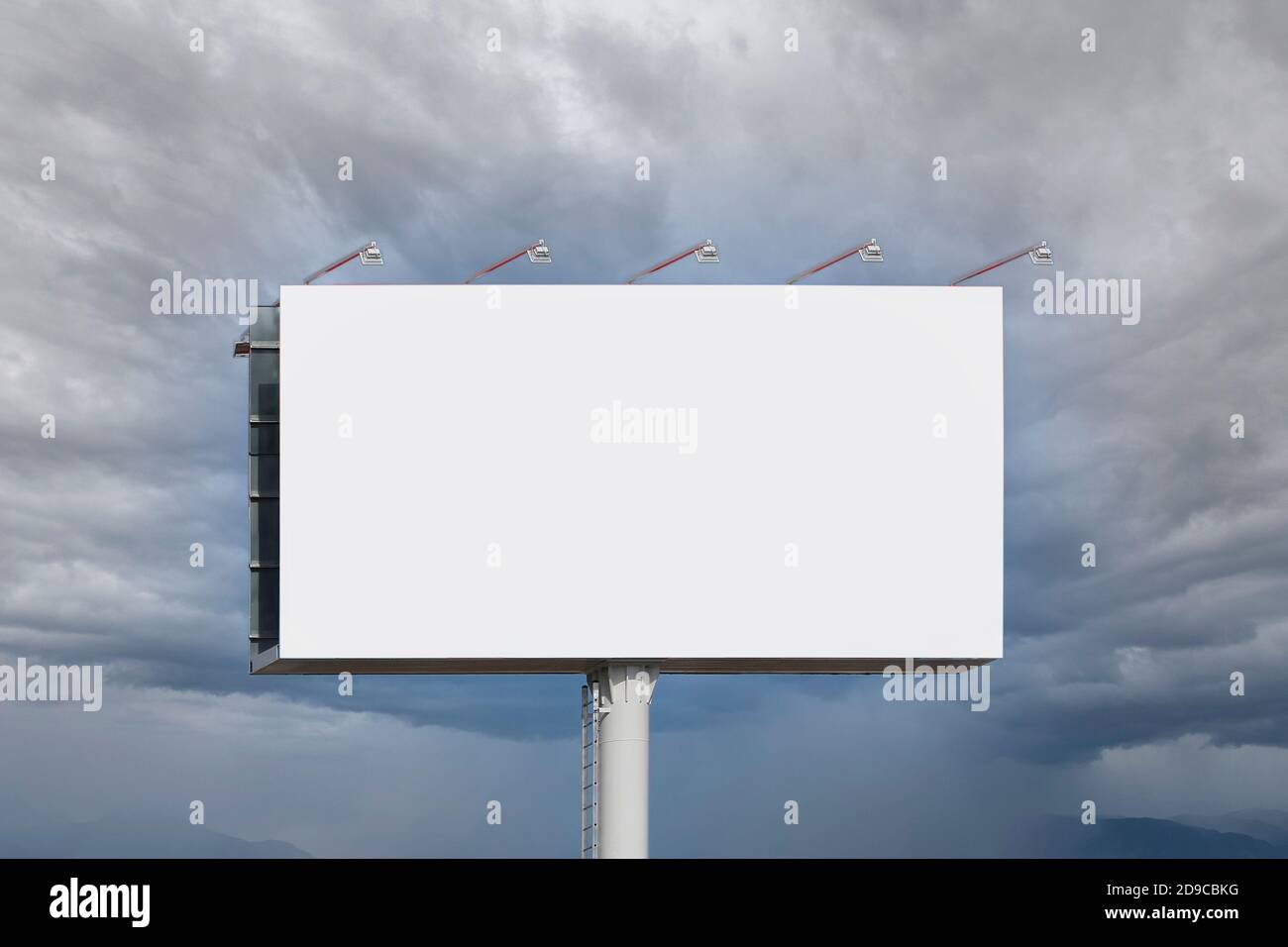 Blank billboard for advertising, against clouds Stock Photo